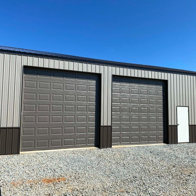 Gray commercial garage doors on metal building